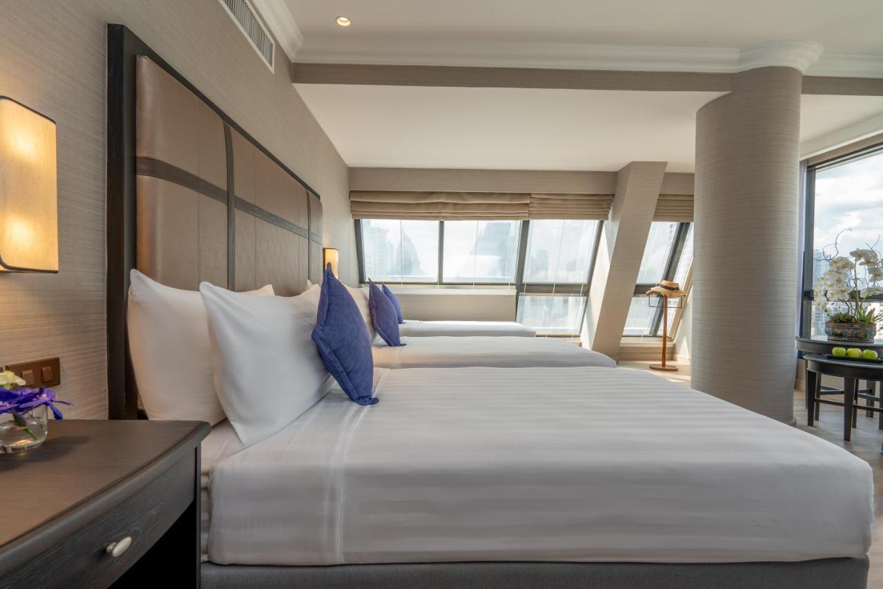 Nh Bangkok Sukhumvit Boulevard Exterior foto A bedroom at the hotel